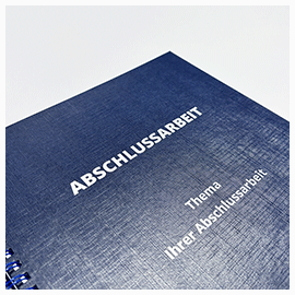 Abschlussarbeiten im Hardcover mit Drahtringbindung Nahansicht Coverbeschriftung in Silber